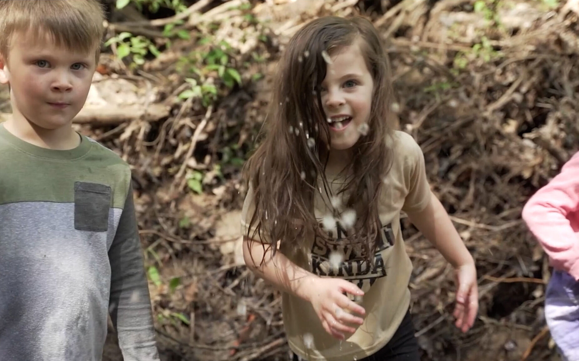 Children playing outside in a creek | UPC Discovery